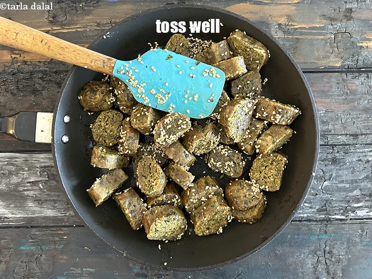 Step 32 – <p>Toss <strong>nachni methi muthia </strong>well.</p>