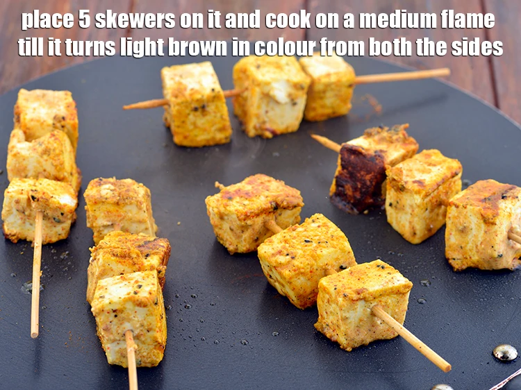 Step 11 – <p><span style="background-color:rgb(255,255,255);color:rgb(0,0,0);">Place 5 skewers on it and cook on a medium flame till it turns …