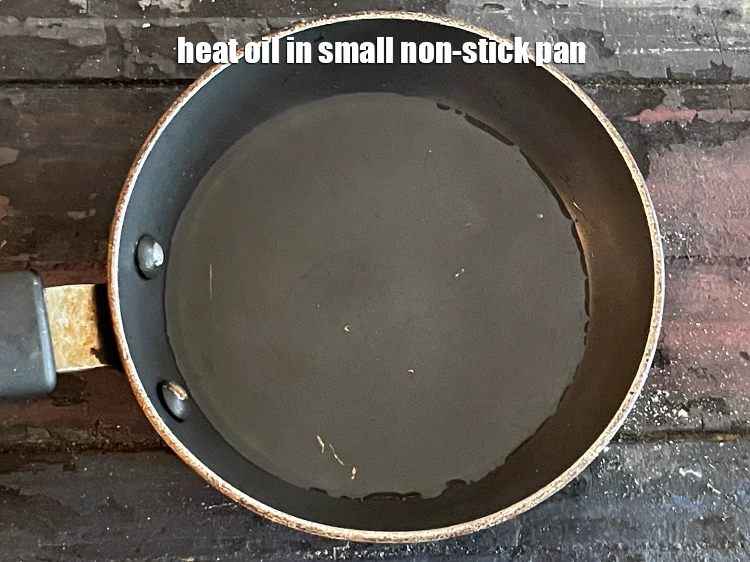 Step 24 – <p><span style="background-color:rgb(255,255,255);color:rgb(0,0,0);">Prepare the tempering, &nbsp;Heat </span>2 tsp <a href="https://www.tarladalal.com/glossary-oil-671i"><u>oil</u></a><span style="background-color:rgb(255,255,255);color:rgb(0,0,0);"> in small non-stick pan.</span></p>