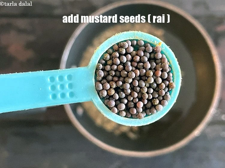 Step 26 – <p>Add 1/2 tsp <a href="https://www.tarladalal.com/glossary-mustard-seeds-sarson-rai-sarson-ke-beej-525i"><u>mustard seeds ( rai / sarson)</u></a><u>.</u></p>