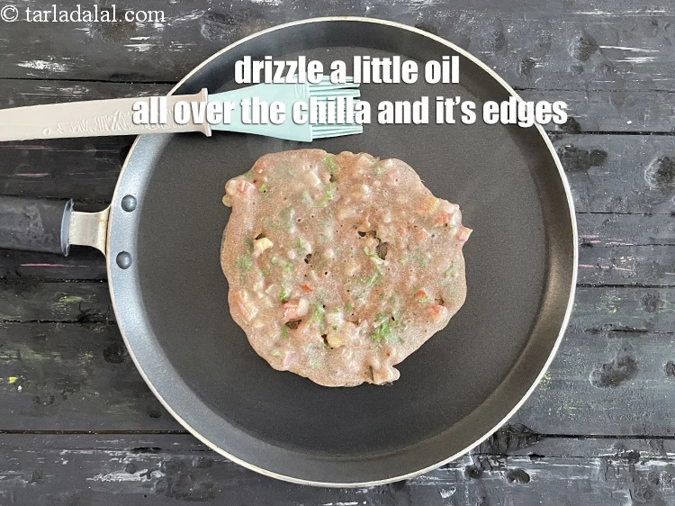 Step 17 – <html><head><meta charset="UTF-8"> </head><body><p>Drizzle a little oil all over the chilla and along the edges to …