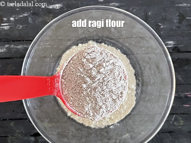 Step 5 – <html><head></head><body><p>Add&nbsp;1/4 cup&nbsp;<a href="glossary-ragi-flour-nachni-flour-nachni-ka-atta-red-millet-flour-1115i">ragi (nachni / red millet) flour</a>.</p></body></html>