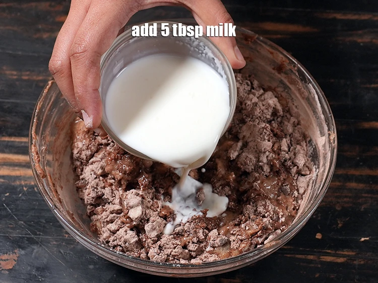 Step 14 – <p>Add 5 tbsp <a href="https://www.tarladalal.com/glossary-milk-doodh-full-cream-milk-514i"><u>milk</u></a><u>.</u></p>