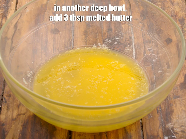 Step 5 – <p><span style="background-color:rgb(255,255,255);color:rgb(0,0,0);">In another deep bowl, add </span>3 tbsp <a href="https://www.tarladalal.com/glossary-butter-makhan-233i#ing_3123"><u>melted butter</u></a><u>.</u></p>