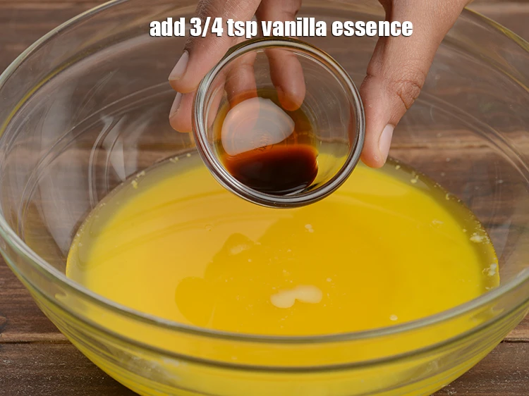 Step 9 – <p><span style="background-color:rgb(255,255,255);color:rgb(0,0,0);">Add </span>3/4 tsp <a href="https://www.tarladalal.com/glossary-vanilla-essence-406i"><u>vanilla essence</u></a>.</p>