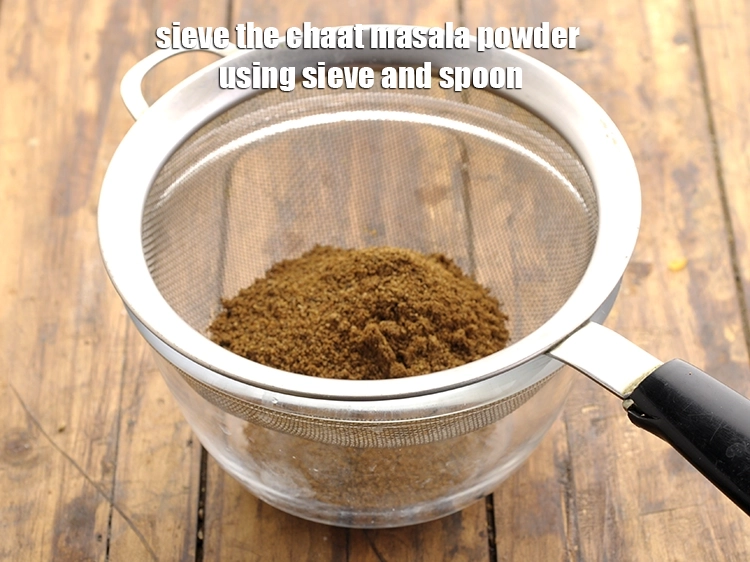 Step 20 – <p><strong>Sieve </strong>the&nbsp;chaat masala powder&nbsp;using sieve and spoon. Discard the little coarse mixture left behind in …