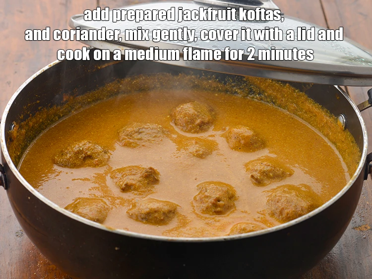 Step 17 – <p><span style="background-color:rgb(255,255,255);color:rgb(0,0,0);">Add the <strong>prepared jackfruit koftas</strong>, and </span>2 tbsp <a href="https://www.tarladalal.com/glossary-coriander-dhania-kothmir-369i#ing_2365"><u>chopped coriander (dhania)</u></a><span style="background-color:rgb(255,255,255);color:rgb(0,0,0);">, <strong>mix …