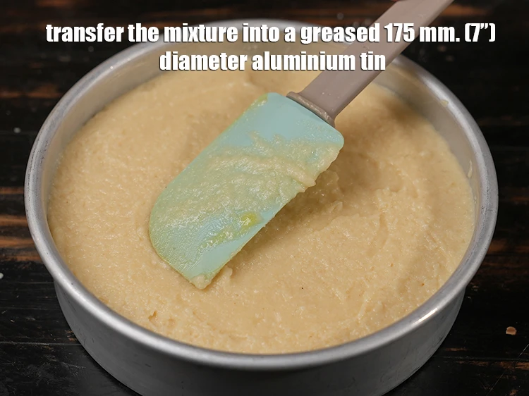 Step 11 – <p><span style="background-color:rgb(255,255,255);color:rgb(0,0,0);">Pour the <strong>batter</strong> into a lined tin and spread it evenly.</span></p>