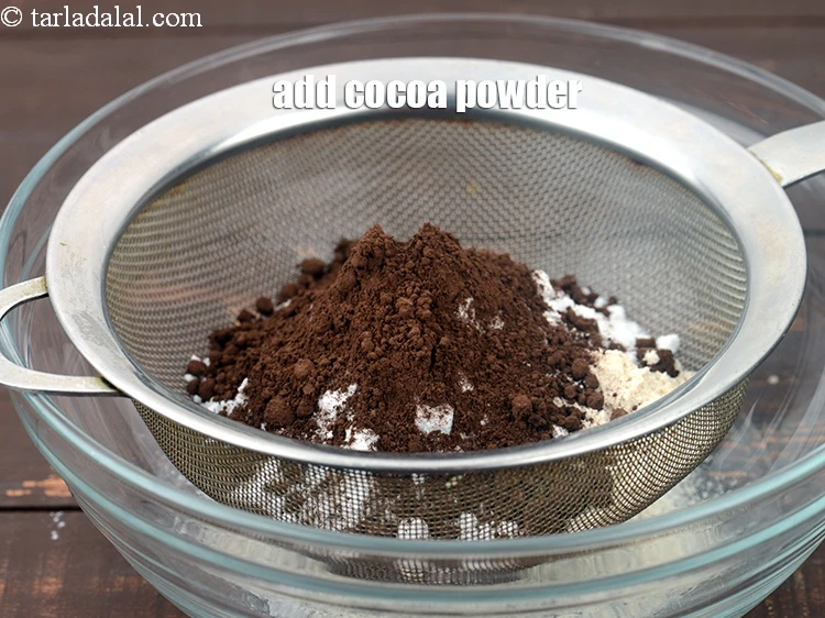 Step 5 – <p style="margin-left:0px;">Add 5 tbsp <a href="https://www.tarladalal.com/glossary-cocoa-powder-284i"><u>cocoa powder</u></a>.</p>