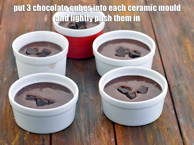 Step 10 – <p><span style="background-color:rgb(255,255,255);color:rgb(0,0,0);">Put 3 chocolate cubes into each ceramic mould and lightly push them in.</span></p>
