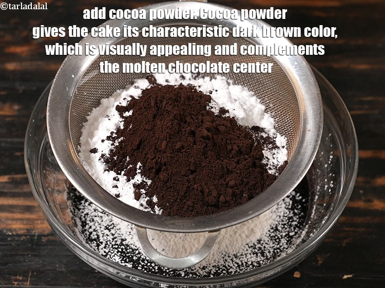 Step 9 – <p><span style="background-color:rgb(255,255,255);color:rgb(0,0,0);">Add </span>8 tbsp <a href="https://www.tarladalal.com/glossary-cocoa-powder-284i"><u>cocoa powder</u></a><span style="background-color:rgb(255,255,255);color:rgb(0,0,0);">. Cocoa powder gives the cake its characteristic …