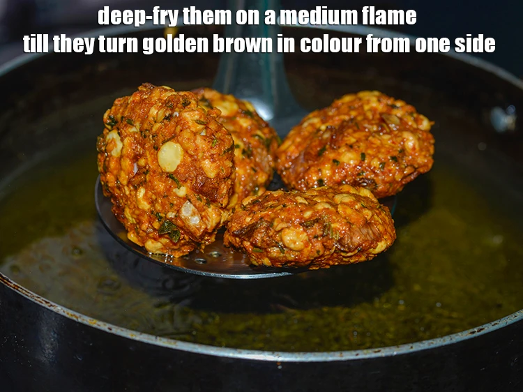 Step 29 – <p>Take care to deep-fry these&nbsp;<strong>South Indian dal vadas</strong>&nbsp;on a medium flame. Otherwise, they will quickly …