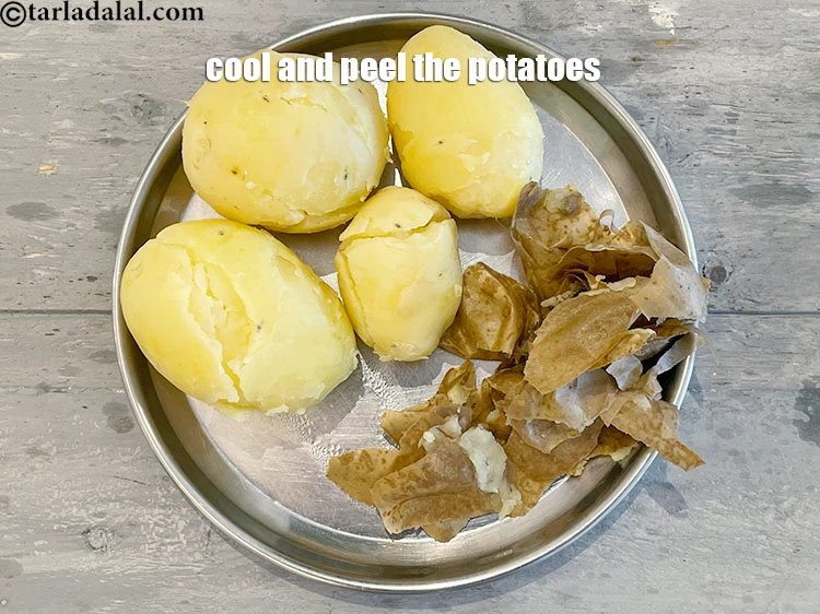 Step 19 – <p>Cool and peel the potatoes with your fingers.</p>