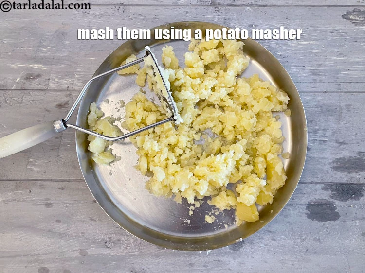 Step 20 – <p>Mash them using a potato masher or heavy fork. Ensure that there are no lumps …