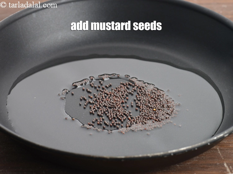 Step 10 – <p>Add the 1/2 tsp <a href="https://www.tarladalal.com/glossary-mustard-seeds-sarson-rai-sarson-ke-beej-525i"><u>mustard seeds ( rai / sarson)</u></a><u>.</u></p>