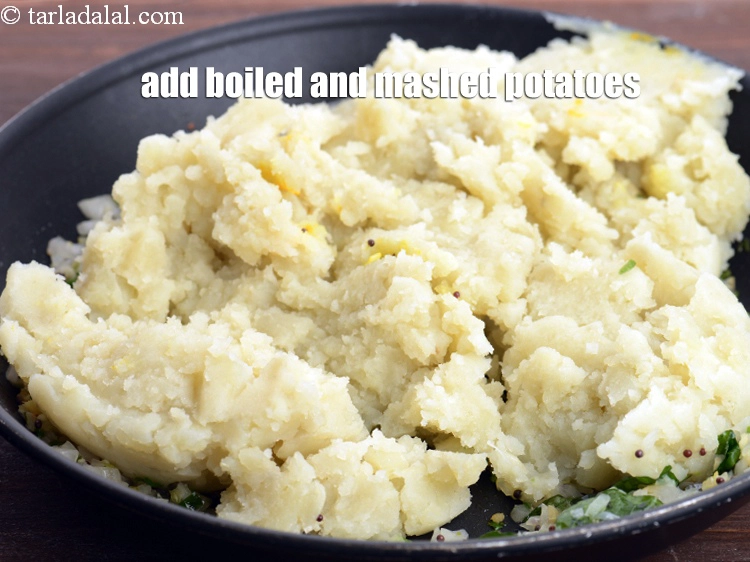 Step 37 – <p>Add the 1 1/2 cups boiled , peeled and <a href="https://www.tarladalal.com/glossary-potatoes-aloo-alu-batata-710i#ing_2516"><u>boiled and mashed potatoes</u></a><u>.</u></p>