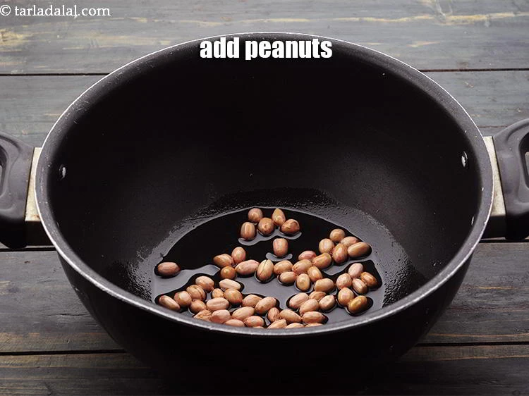 Step 4 – <p>Add the <a href="https://www.tarladalal.com/glossary-raw-peanuts-kachi-mungfali-kachi-moongfali-847i">peanuts</a>.</p>