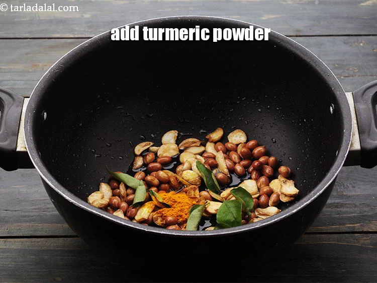 Step 9 – <p>Add the <a href="https://www.tarladalal.com/glossary-turmeric-powder-haldi-645i">turmeric powder</a>.</p>