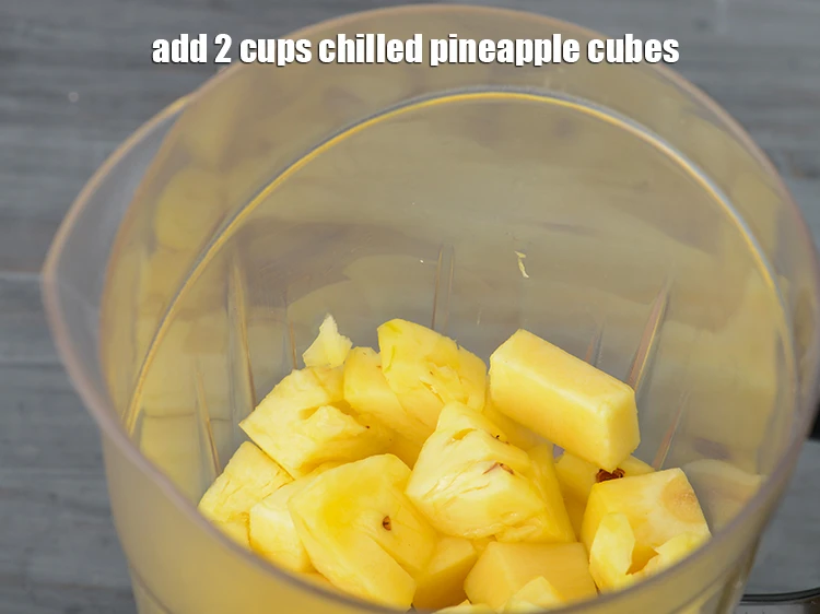Step 2 – <p>Add 2 cups chilled <a href="https://www.tarladalal.com/glossary-pineapple-ananas-88i#ing_2991"><u>pineapple cubes</u></a><u>.</u></p>