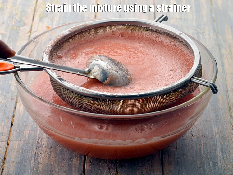 Step 4 – <p><strong>Strain</strong> the mixture using a strainer.</p>