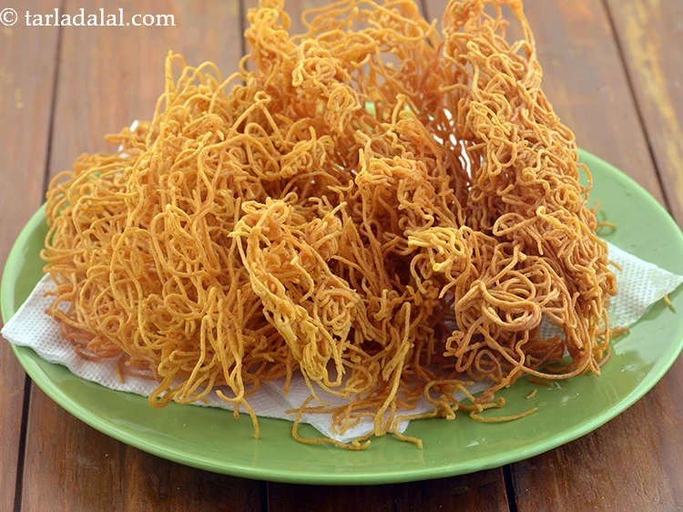 Step 47 – <p>Keep aside to cool for 5 to 10 minutes. The sev will turn crisp at …