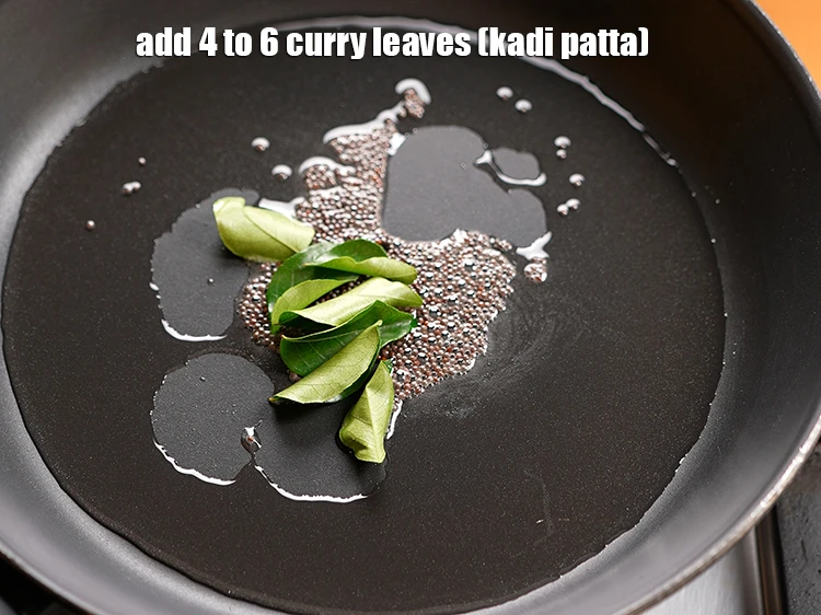 Step 5 – <p>Add 4 to 6&nbsp;<a href="https://www.tarladalal.com/glossary-curry-leaves-kadi-patta-kadipatta-388i">curry leaves (kadi patta)</a>.</p>