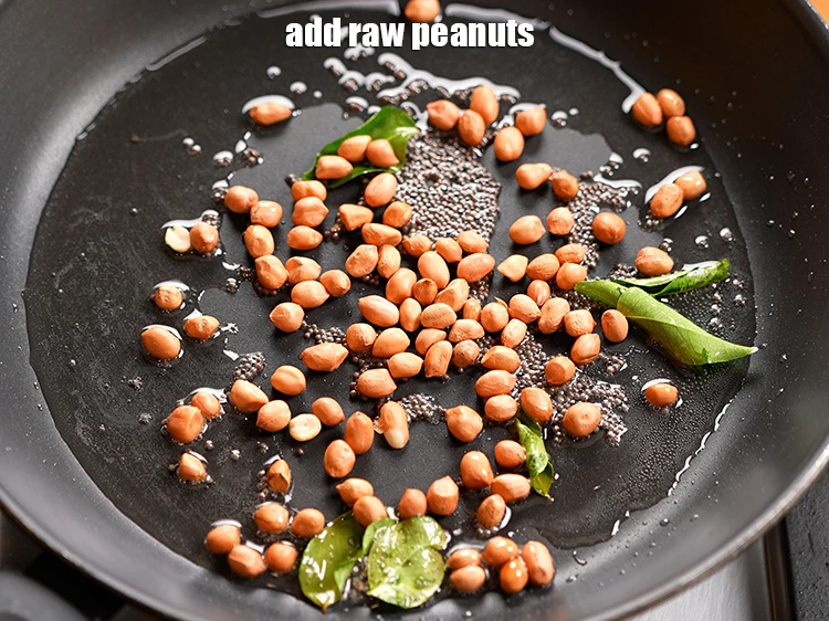 Step 6 – <p>Once the seeds crackle and leaves turn a little crisp, add 1/4 cup&nbsp;<a href="https://www.tarladalal.com/glossary-raw-peanuts-kachi-mungfali-kachi-moongfali-847i">raw peanuts</a>.</p>