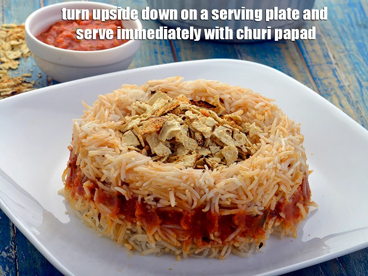 Step 12 – <p><span style="background-color:rgb(255,255,255);color:rgb(0,0,0);">Turn upside down on a serving plate and serve <strong>Bhaji Pulao, Layered Pav Bhaji …