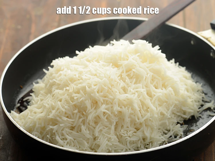 Step 6 – <p>Add <span style="color:rgb(13,13,13);">1 1/2 cups </span><a href="https://www.tarladalal.com/cooked-rice-32639r"><u>cooked rice</u></a><strong><u>.</u></strong></p>