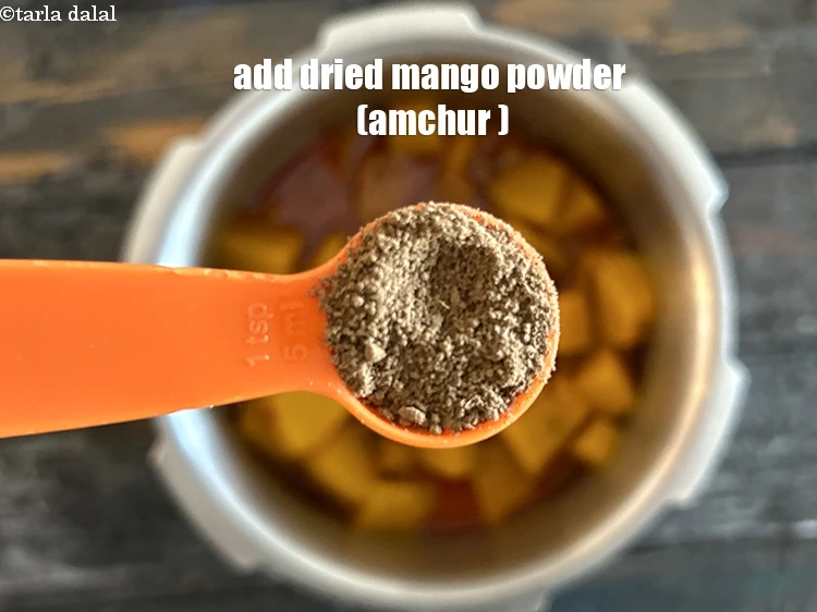 Step 20 – <html><head></head><body><p>Add&nbsp;2 tsp&nbsp;<a href="glossary-dried-mango-powder-amchur-powder-148i">dried mango powder (amchur)</a>.</p></body></html>