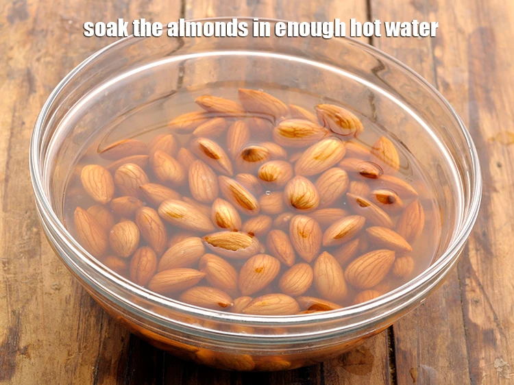 Step 2 – <p><span style="background-color:rgb(255,255,255);color:rgb(0,0,0);">Soak the <strong>almonds</strong> in enough <strong>hot water</strong>.</span></p>