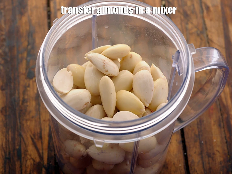 Step 6 – <p><span style="background-color:rgb(255,255,255);color:rgb(0,0,0);">Transfer the <strong>soaked and de-skinned almonds</strong> to a mixer jar.</span></p>