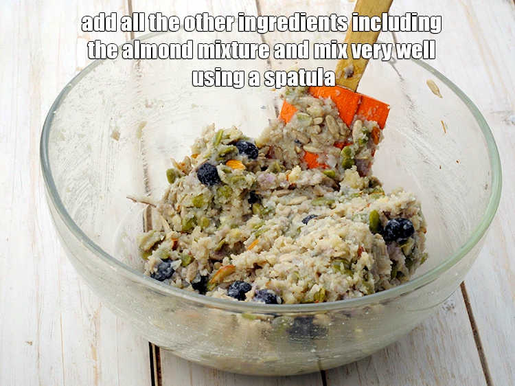 Step 9 – <p><span style="background-color:rgb(255,255,255);color:rgb(0,0,0);">Add <strong>almond mixture,</strong> </span>1/2 cup freshly <a href="https://www.tarladalal.com/glossary-coconut-nariyal-269i#ing_3229"><u>grated coconut</u></a><u>, </u>1/2 cup <a href="https://www.tarladalal.com/glossary-pumpkin-seeds-pepitas-kaddu-ke-beej-857i"><u>pumpkin seeds</u></a><u>, …