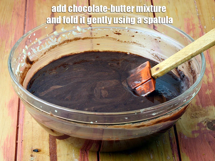 Step 7 – <p><span style="background-color:rgb(255,255,255);color:rgb(0,0,0);">Add the <strong>chocolate-butter mixture</strong> and fold it gently using a spatula.</span></p>