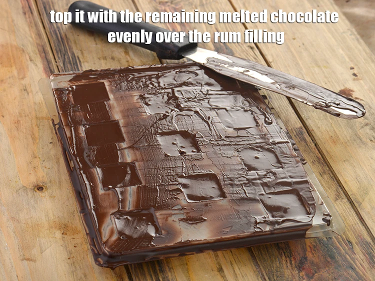 Step 10 – <p><span style="background-color:rgb(255,255,255);color:rgb(0,0,0);">Top it with the remaining <strong>melted chocolate</strong> evenly over the rum filling.</span></p>