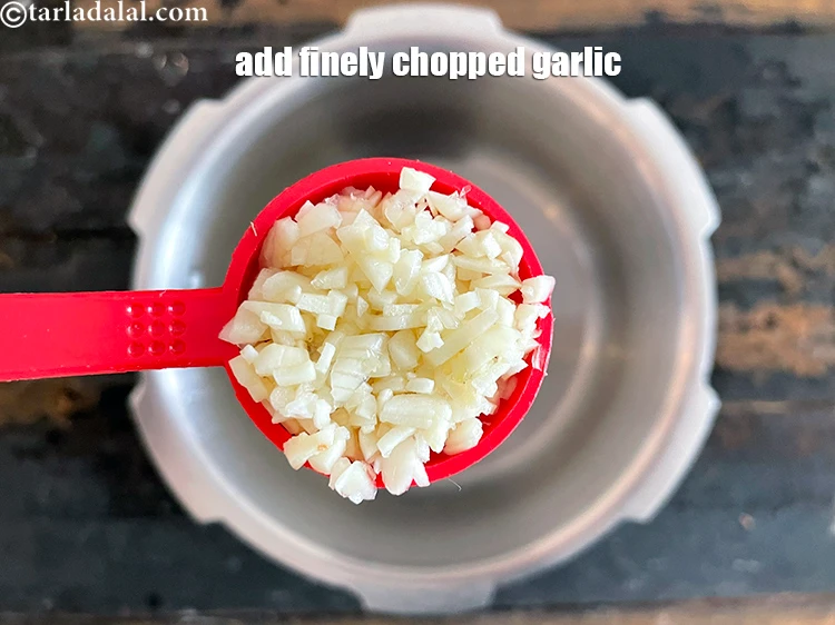 Step 9 – <html><head></head><body><p>Add&nbsp;1 1/2 tbsp&nbsp;finely&nbsp;<a href="glossary-chopped-garlic-790i">chopped garlic (lehsun)</a>.</p></body></html>