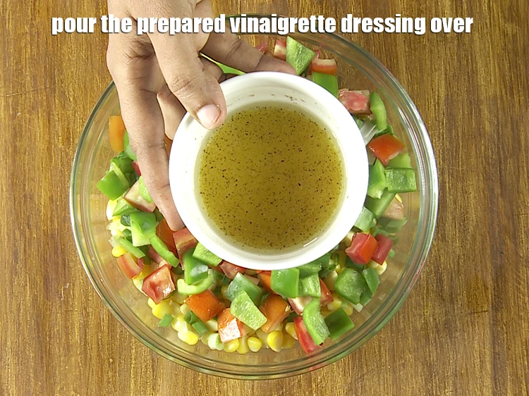 Step 21 – <p>Pour the <strong>prepared vinaigrette dressing</strong> over the&nbsp;<strong>American sweet corn salad</strong>.</p>