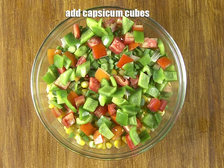Step 12 – <p>Add the 1/2 cup <a href="https://www.tarladalal.com/glossary-capsicum-shimla-mirch-bell-pepper-163i#ing_2316"><u>capsicum cubes</u></a>. You can also toss in cucumber, avocados or …