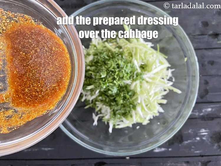 Step 26 – <p><span style="background-color:rgb(255,255,255);color:rgb(0,0,0);">Pour the <strong>prepared dressing</strong> evenly over the cabbage, green chillies and coriander.</span></p>