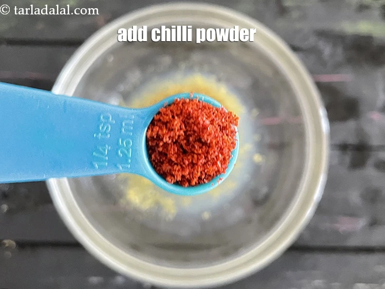 Step 7 – <html><head></head><body><p>Add 1/4 tsp&nbsp;<a href="glossary-chilli-powder-red-chilli-powder-339i">chilli powder</a>. This can be adjusted as per your liking.</p></body></html>