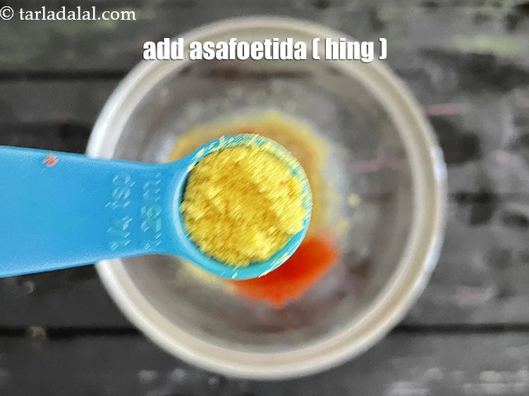 Step 8 – <html><head></head><body><p>Add 1/4 tsp&nbsp;<a href="glossary-asafoetida-hing-113i">asafoetida (hing)</a>. This is optional though.</p></body></html>