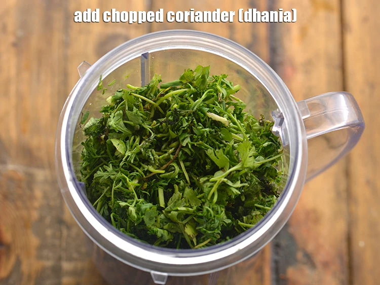 Step 13 – <p>Add 1/2 cup <a href="https://www.tarladalal.com/glossary-coriander-dhania-kothmir-369i#ing_2365"><u>chopped coriander (dhania)</u></a><u>.</u></p>