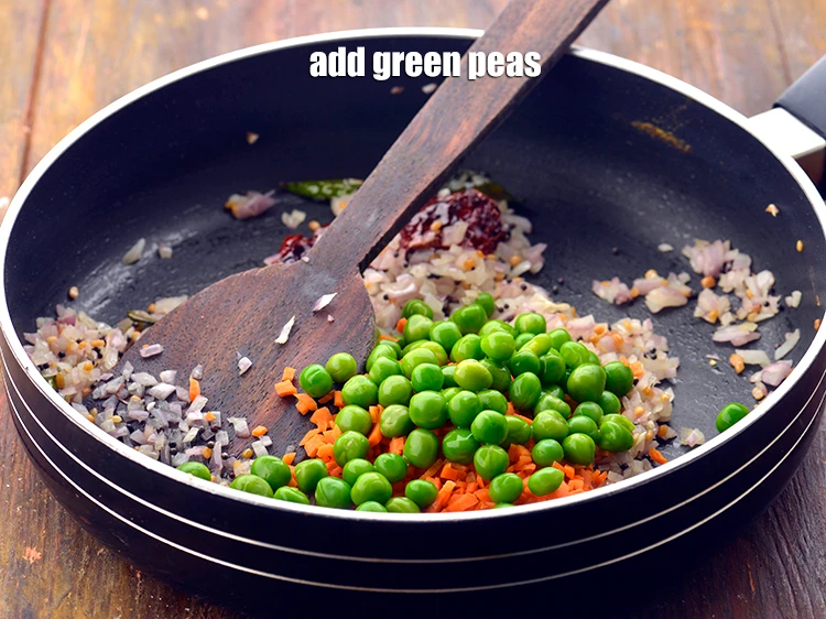 Step 16 – <p>Add the 1/4 cup <a href="https://www.tarladalal.com/glossary-green-peas-matar-hare-matar-vatana-180i"><u>green peas</u></a>. You can add any vegetable of your choice …