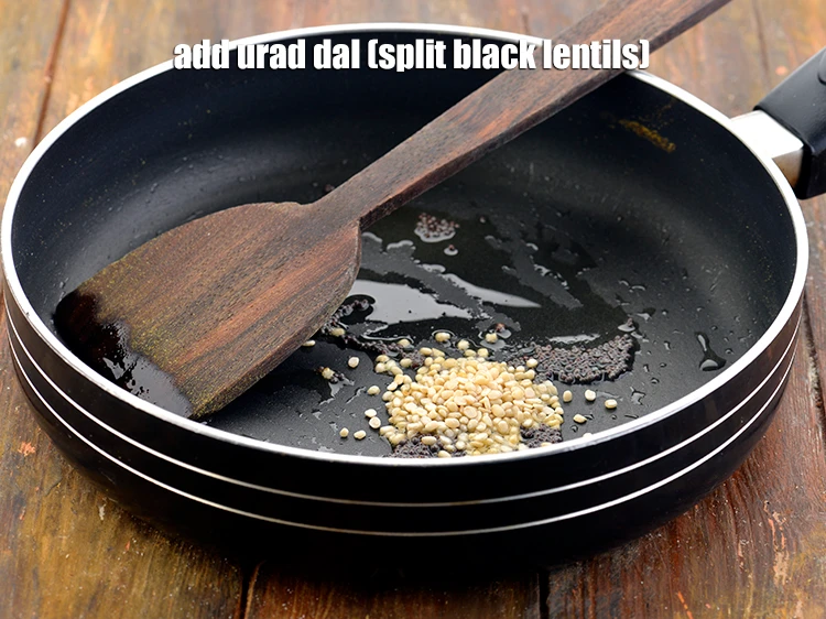 Step 9 – <p><strong>When the seeds crackle, </strong>add the 1 tsp <a href="https://www.tarladalal.com/glossary-urad-dal-split-black-lentil-941i"><u>urad dal (split black lentils)</u></a>. You …