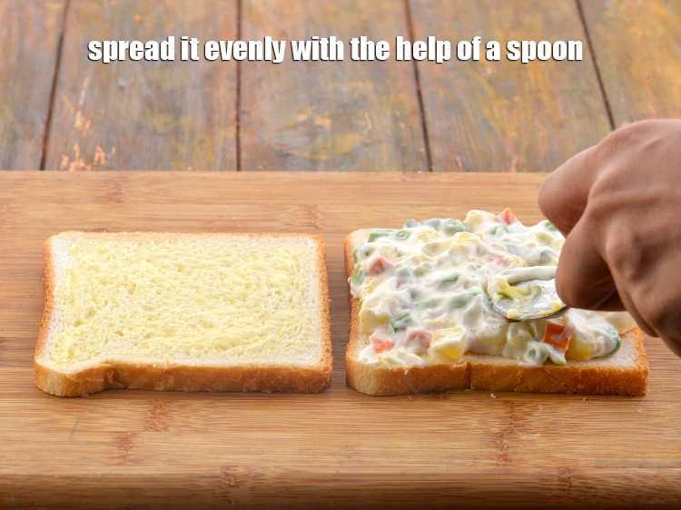 Step 14 – <p><strong>Spread it evenly</strong> with the help of a spoon.</p>