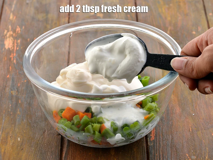 Step 5 – <p>Then, add the 2 tbsp <a href="https://www.tarladalal.com/glossary-fresh-cream-1877i"><u>fresh cream</u></a> to it.</p>