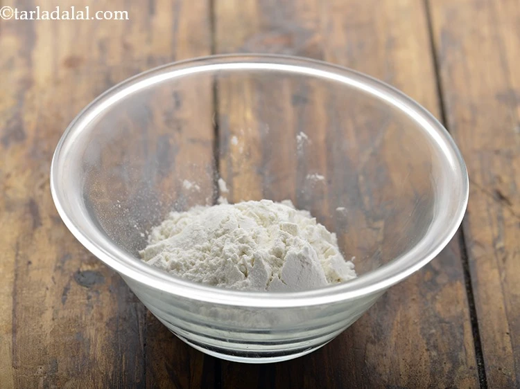 Step 16 – <p>To make a sealing paste for the <strong>Spring Rolls</strong>, take 1/4 cup <a href="https://www.tarladalal.com/glossary-plain-flour-maida-188i"><u>plain flour …