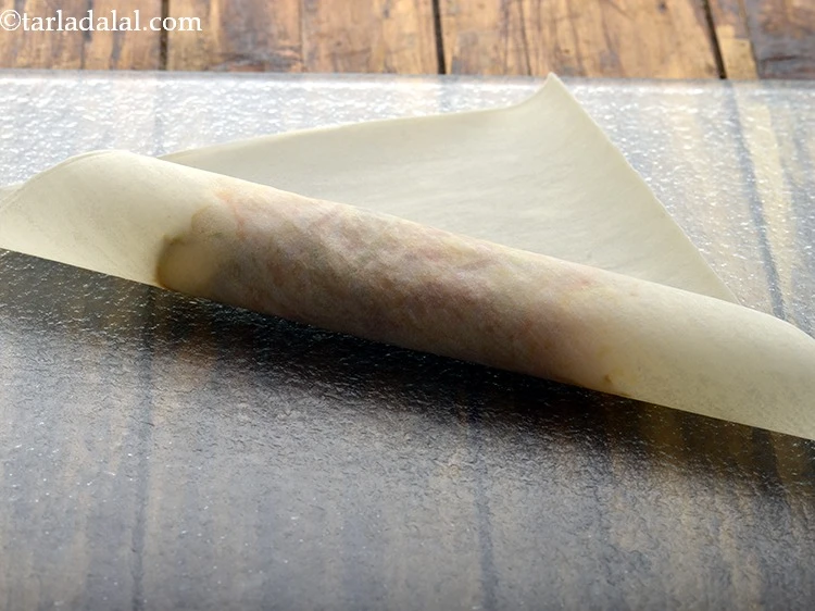 Step 20 – <p><strong>Roll</strong> over the wrapper till ¾th.</p>