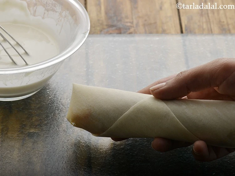 Step 23 – <p><strong>Seal</strong> the edge using a little maida-water mixture.</p>