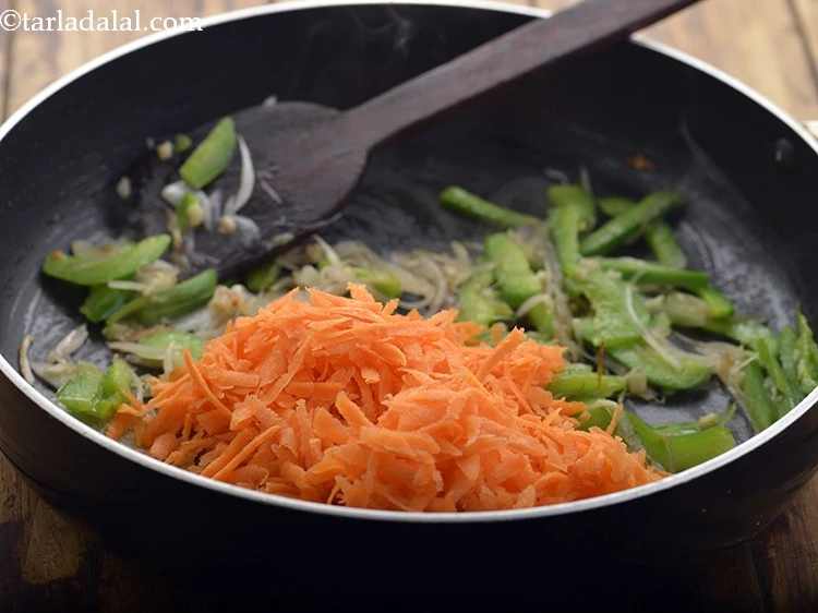 Step 8 – <p>Add the 1 cup thickly <a href="https://www.tarladalal.com/glossary-carrot-gajar-gajjar-253i#ing_2385"><u>grated carrot</u></a>. Broccoli, mushroom, babycorn, spinach, pakchoy can also …